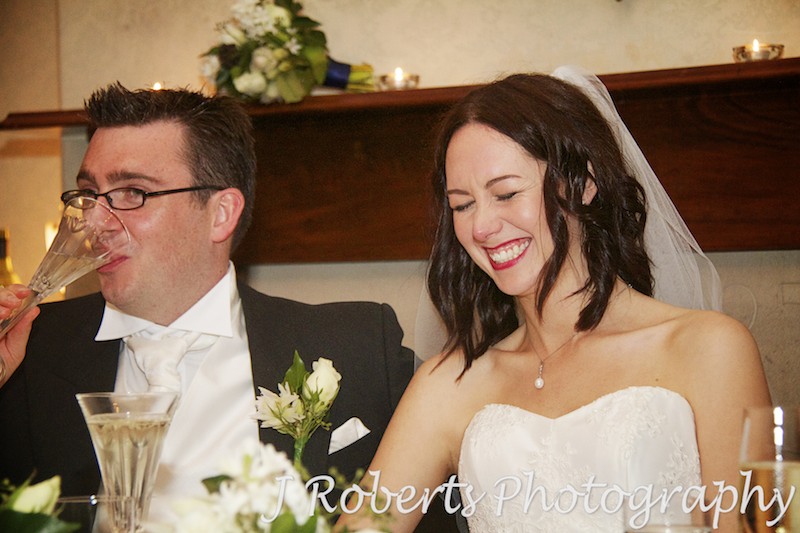 Bride laughing at speeches - wedding photography sydney